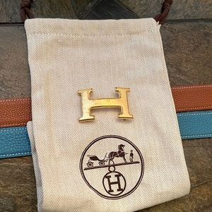 Authentic Hermes gold buckle with two authentic Hermes belt straps. Blue/brown